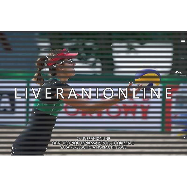 20.08.2014 - Stare Jablonki , siatkowka plazowa , beach volleyball , World Tour , FIVB Stare Jablonki Grand Slam 2014 , Wlochy (niebieskie) - Szwajcaria (zielone) , Italy (blue) - Switzerland (green) N/Z Tanja Huberli Fot. Karol Bartnik / MPAimages.com/NEWSPIX.PL --- Newspix.pl /Agenzia Aldo Liverani sas - ITALY ONLY - Italia - Svizzera beach volley, World Tour, FIVB Grande Slam 2014 *** Local Caption *** www.newspix.pl mail us: info@newspix.pl call us: 0048 022 23 22 222 --- Polish Picture Agency by Ringier Axel Springer Poland
