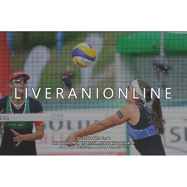 20.08.2014 - Stare Jablonki , siatkowka plazowa , beach volleyball , World Tour , FIVB Stare Jablonki Grand Slam 2014 , Wlochy (niebieskie) - Szwajcaria (zielone) , Italy (blue) - Switzerland (green) N/Z Marta Menegatti Fot. Karol Bartnik / MPAimages.com/NEWSPIX.PL --- Newspix.pl /Agenzia Aldo Liverani sas - ITALY ONLY - Italia - Svizzera beach volley, World Tour, FIVB Grande Slam 2014 *** Local Caption *** www.newspix.pl mail us: info@newspix.pl call us: 0048 022 23 22 222 --- Polish Picture Agency by Ringier Axel Springer Poland