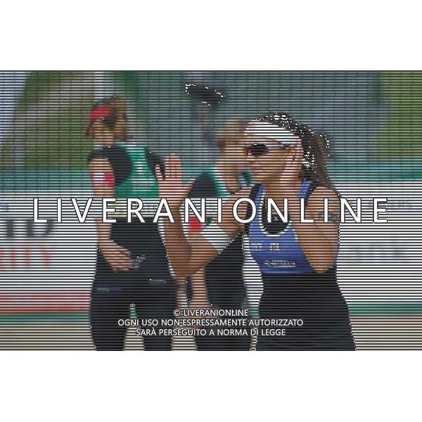 20.08.2014 - Stare Jablonki , siatkowka plazowa , beach volleyball , World Tour , FIVB Stare Jablonki Grand Slam 2014 , Wlochy (niebieskie) - Szwajcaria (zielone) , Italy (blue) - Switzerland (green) N/Z Marta Menegatti Fot. Karol Bartnik / MPAimages.com/NEWSPIX.PL --- Newspix.pl /Agenzia Aldo Liverani sas - ITALY ONLY - Italia - Svizzera beach volley, World Tour, FIVB Grande Slam 2014 *** Local Caption *** www.newspix.pl mail us: info@newspix.pl call us: 0048 022 23 22 222 --- Polish Picture Agency by Ringier Axel Springer Poland