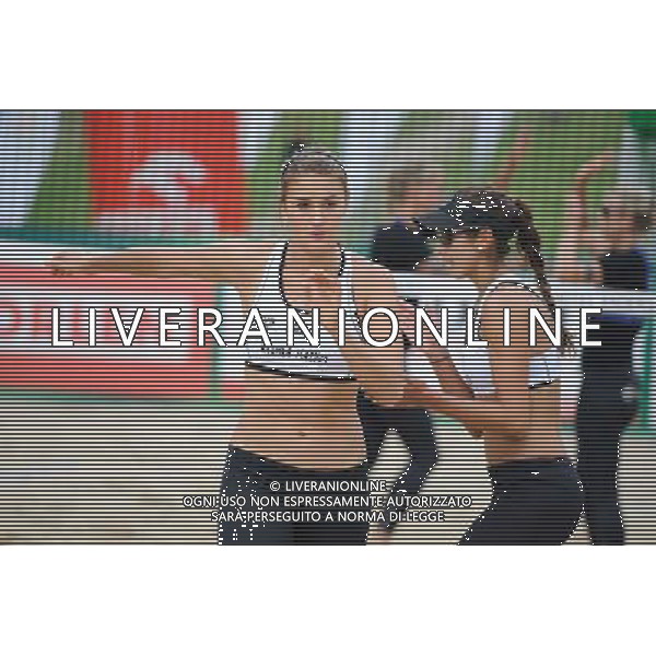 20.08.2014 - Stare Jablonki , siatkowka plazowa , beach volleyball , World Tour , FIVB Stare Jablonki Grand Slam 2014 , Niemcy (niebieski) -Kanada (bialy) , Germany (blue) - Canada (white) N/Z Taylor Pischke , Melissa Humana Paredes Fot. Karol Bartnik / MPAimages.com/NEWSPIX.PL --- Newspix.pl /Agenzia Aldo Liverani sas - ITALY ONLY - Germania - Canada beach volley, World Tour, FIVB Grande Slam 2014 *** Local Caption *** www.newspix.pl mail us: info@newspix.pl call us: 0048 022 23 22 222 --- Polish Picture Agency by Ringier Axel Springer Poland