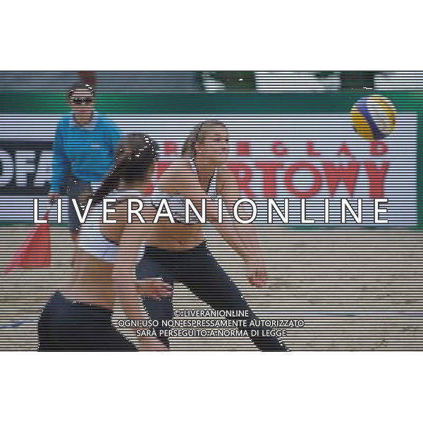 20.08.2014 - Stare Jablonki , siatkowka plazowa , beach volleyball , World Tour , FIVB Stare Jablonki Grand Slam 2014 , Niemcy (niebieski) -Kanada (bialy) , Germany (blue) - Canada (white) N/Z Taylor Pischke Fot. Karol Bartnik / MPAimages.com/NEWSPIX.PL --- Newspix.pl /Agenzia Aldo Liverani sas - ITALY ONLY - Germania - Canada beach volley, World Tour, FIVB Grande Slam 2014 *** Local Caption *** www.newspix.pl mail us: info@newspix.pl call us: 0048 022 23 22 222 --- Polish Picture Agency by Ringier Axel Springer Poland