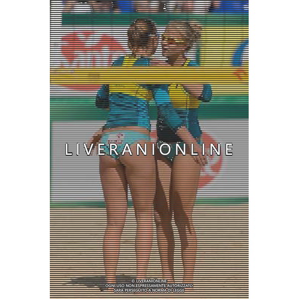 20.08.2014 - Stare Jablonki , siatkowka plazowa , beach volleyball , World Tour , FIVB Stare Jablonki Grand Slam 2014 , Polska (zolte) - Rosja (biale) , Poland - Russia N/Z Karolina Baran , Jagoda Gruszczynska Fot. Mariusz Palczynski / MPAimages.com/NEWSPIX.PL --- Newspix.pl /Agenzia Aldo Liverani sas - ITALY ONLY - Polonia - Russia beach volley, World Tour, FIVB Stare Jablonki Grande Slam 2014 *** Local Caption *** www.newspix.pl mail us: info@newspix.pl call us: 0048 022 23 22 222 --- Polish Picture Agency by Ringier Axel Springer Poland