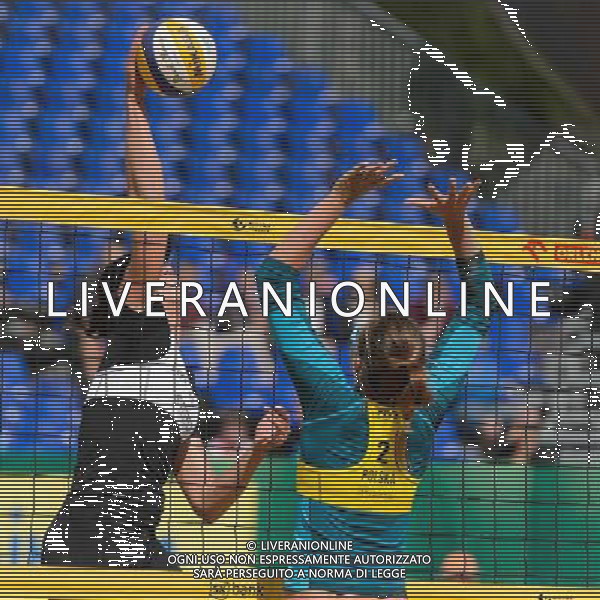 20.08.2014 - Stare Jablonki , siatkowka plazowa , beach volleyball , World Tour , FIVB Stare Jablonki Grand Slam 2014 , Polska (zolte) - Rosja (biale) , Poland - Russia N/Z Evgenia Ukolova , Karolina Baran Fot. Mariusz Palczynski / MPAimages.com/NEWSPIX.PL --- Newspix.pl /Agenzia Aldo Liverani sas - ITALY ONLY - Polonia - Russia beach volley, World Tour, FIVB Stare Jablonki Grande Slam 2014 *** Local Caption *** www.newspix.pl mail us: info@newspix.pl call us: 0048 022 23 22 222 --- Polish Picture Agency by Ringier Axel Springer Poland