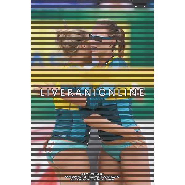 20.08.2014 - Stare Jablonki , siatkowka plazowa , beach volleyball , World Tour , FIVB Stare Jablonki Grand Slam 2014 , Polska (zolte) - Rosja (biale) , Poland - Russia N/Z Jagoda Gruszczynska , Karolina Baran Fot. Mariusz Palczynski / MPAimages.com/NEWSPIX.PL --- Newspix.pl /Agenzia Aldo Liverani sas - ITALY ONLY - Polonia - Russia beach volley, World Tour, FIVB Stare Jablonki Grande Slam 2014 *** Local Caption *** www.newspix.pl mail us: info@newspix.pl call us: 0048 022 23 22 222 --- Polish Picture Agency by Ringier Axel Springer Poland
