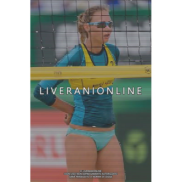 20.08.2014 - Stare Jablonki , siatkowka plazowa , beach volleyball , World Tour , FIVB Stare Jablonki Grand Slam 2014 , Polska (zolte) - Rosja (biale) , Poland - Russia N/Z Karolina Baran Fot. Mariusz Palczynski / MPAimages.com/NEWSPIX.PL --- Newspix.pl /Agenzia Aldo Liverani sas - ITALY ONLY - Polonia - Russia beach volley, World Tour, FIVB Stare Jablonki Grande Slam 2014 *** Local Caption *** www.newspix.pl mail us: info@newspix.pl call us: 0048 022 23 22 222 --- Polish Picture Agency by Ringier Axel Springer Poland