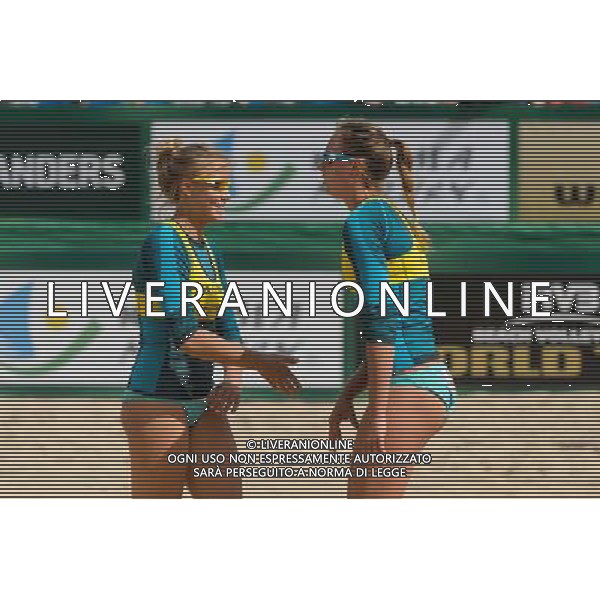 20.08.2014 - Stare Jablonki , siatkowka plazowa , beach volleyball , World Tour , FIVB Stare Jablonki Grand Slam 2014 , Polska (zolte) - Rosja (biale) , Poland - Russia N/Z Jagoda Gruszczynska , Karolina Baran Fot. Mariusz Palczynski / MPAimages.com/NEWSPIX.PL --- Newspix.pl /Agenzia Aldo Liverani sas - ITALY ONLY - Polonia - Russia beach volley, World Tour, FIVB Stare Jablonki Grande Slam 2014 *** Local Caption *** www.newspix.pl mail us: info@newspix.pl call us: 0048 022 23 22 222 --- Polish Picture Agency by Ringier Axel Springer Poland