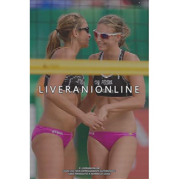 20.08.2014 - Stare Jablonki , siatkowka plazowa , beach volleyball , World Tour , FIVB Stare Jablonki Grand Slam 2014 , Brazylia (zolte) - Polska (czarne) , Brazil - Poland N/Z Dorota Strag , Katarzyna Kociolek Fot. Mariusz Palczynski / MPAimages.com/NEWSPIX.PL --- Newspix.pl /Agenzia Aldo Liverani sas - ITALY ONLY - Brasile - Polonia beach volley, World Tour, FIVB Grande Slam 2014 *** Local Caption *** www.newspix.pl mail us: info@newspix.pl call us: 0048 022 23 22 222 --- Polish Picture Agency by Ringier Axel Springer Poland