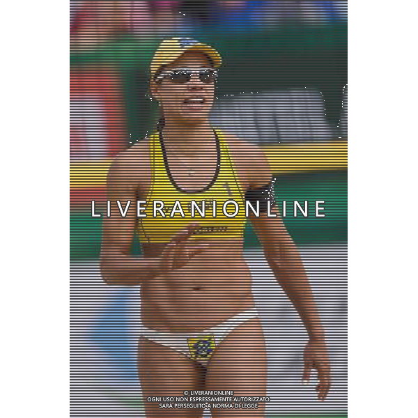 20.08.2014 - Stare Jablonki , siatkowka plazowa , beach volleyball , World Tour , FIVB Stare Jablonki Grand Slam 2014 , Brazylia (zolte) - Polska (czarne) , Brazil - Poland N/Z Juliana Felisberta Da Silva Fot. Mariusz Palczynski / MPAimages.com/NEWSPIX.PL --- Newspix.pl /Agenzia Aldo Liverani sas - ITALY ONLY - Brasile - Polonia beach volley, World Tour, FIVB Grande Slam 2014 *** Local Caption *** www.newspix.pl mail us: info@newspix.pl call us: 0048 022 23 22 222 --- Polish Picture Agency by Ringier Axel Springer Poland
