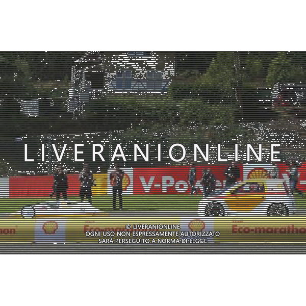 (L to R): Fernando Alonso (ESP) Ferrari and team mate Kimi Raikkonen (FIN) Ferrari drive cars from the Shell Eco Marathon. 21.08.2014. Formula 1 World Championship, Rd 12, Belgian Grand Prix, Spa Francorchamps, Belgium, Preparation Day. AG ALDO LIVERANI SAS ONLY ITALY