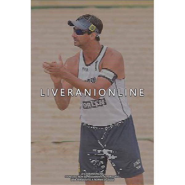 21.08.2014 - Stare Jablonki , siatkowka plazowa , beach volleyball , World Tour , FIVB Stare Jablonki Grand Slam 2014 , Polska (czerwone) - Brazylia (biale) , Poland - Brazil N/Z Ricardo Alex Costa Santos Fot. Mariusz Palczynski / MPAimages.com/NEWSPIX.PL --- Newspix.pl /Agenzia Aldo Liverani sas - ITALY ONLY - Polonia - Brasile beach volley, World Tour, FIVB Stare Jablonki Grande Slam 2014 *** Local Caption *** www.newspix.pl mail us: info@newspix.pl call us: 0048 022 23 22 222 --- Polish Picture Agency by Ringier Axel Springer Poland