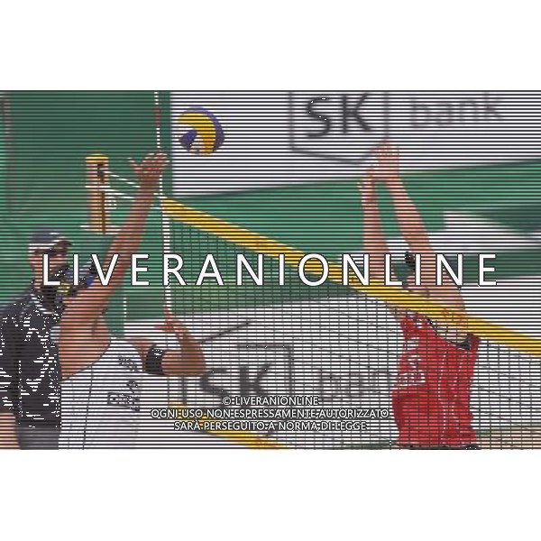 21.08.2014 - Stare Jablonki , siatkowka plazowa , beach volleyball , World Tour , FIVB Stare Jablonki Grand Slam 2014 , Polska (czerwone) - Brazylia (biale) , Poland - Brazil N/Z Ricardo Alex Costa Santos , Michal Kadziola Fot. Mariusz Palczynski / MPAimages.com/NEWSPIX.PL --- Newspix.pl /Agenzia Aldo Liverani sas - ITALY ONLY - Polonia - Brasile beach volley, World Tour, FIVB Stare Jablonki Grande Slam 2014 *** Local Caption *** www.newspix.pl mail us: info@newspix.pl call us: 0048 022 23 22 222 --- Polish Picture Agency by Ringier Axel Springer Poland