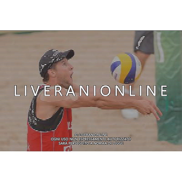 21.08.2014 - Stare Jablonki , siatkowka plazowa , beach volleyball , World Tour , FIVB Stare Jablonki Grand Slam 2014 , Polska (czerwone) - Brazylia (biale) , Poland - Brazil N/Z Michal Kadziola Fot. Mariusz Palczynski / MPAimages.com/NEWSPIX.PL --- Newspix.pl /Agenzia Aldo Liverani sas - ITALY ONLY - Polonia - Brasile beach volley, World Tour, FIVB Stare Jablonki Grande Slam 2014 *** Local Caption *** www.newspix.pl mail us: info@newspix.pl call us: 0048 022 23 22 222 --- Polish Picture Agency by Ringier Axel Springer Poland