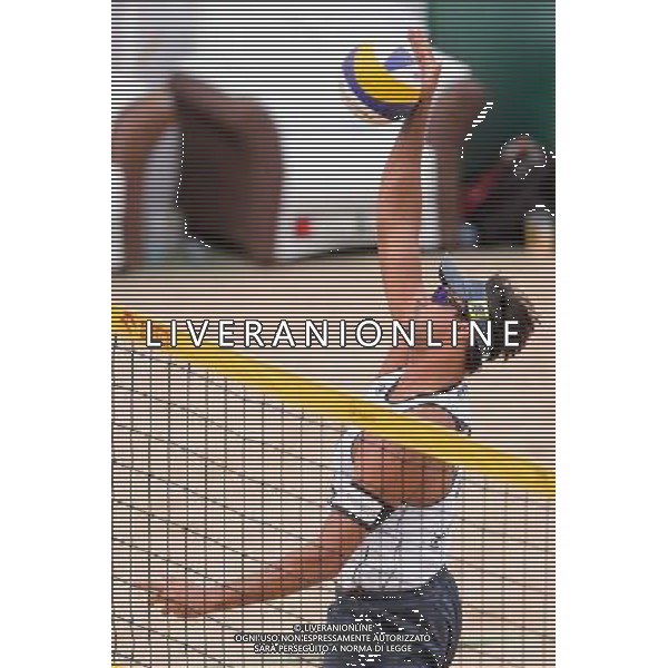 21.08.2014 - Stare Jablonki , siatkowka plazowa , beach volleyball , World Tour , FIVB Stare Jablonki Grand Slam 2014 , Polska (czerwone) - Brazylia (biale) , Poland - Brazil N/Z Ricardo Alex Costa Santos Fot. Mariusz Palczynski / MPAimages.com/NEWSPIX.PL --- Newspix.pl /Agenzia Aldo Liverani sas - ITALY ONLY - Polonia - Brasile beach volley, World Tour, FIVB Stare Jablonki Grande Slam 2014 *** Local Caption *** www.newspix.pl mail us: info@newspix.pl call us: 0048 022 23 22 222 --- Polish Picture Agency by Ringier Axel Springer Poland