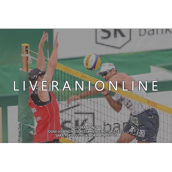 21.08.2014 - Stare Jablonki , siatkowka plazowa , beach volleyball , World Tour , FIVB Stare Jablonki Grand Slam 2014 , Polska (czerwone) - Brazylia (biale) , Poland - Brazil N/Z Michal Kadziola , Marcio Henrique Barroso Araujo Fot. Mariusz Palczynski / MPAimages.com/NEWSPIX.PL --- Newspix.pl /Agenzia Aldo Liverani sas - ITALY ONLY - Polonia - Brasile beach volley, World Tour, FIVB Stare Jablonki Grande Slam 2014 *** Local Caption *** www.newspix.pl mail us: info@newspix.pl call us: 0048 022 23 22 222 --- Polish Picture Agency by Ringier Axel Springer Poland