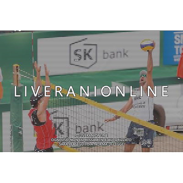 21.08.2014 - Stare Jablonki , siatkowka plazowa , beach volleyball , World Tour , FIVB Stare Jablonki Grand Slam 2014 , Polska (czerwone) - Brazylia (biale) , Poland - Brazil N/Z Michal Kadziola , Marcio Henrique Barroso Araujo Fot. Mariusz Palczynski / MPAimages.com/NEWSPIX.PL --- Newspix.pl /Agenzia Aldo Liverani sas - ITALY ONLY - Polonia - Brasile beach volley, World Tour, FIVB Stare Jablonki Grande Slam 2014 *** Local Caption *** www.newspix.pl mail us: info@newspix.pl call us: 0048 022 23 22 222 --- Polish Picture Agency by Ringier Axel Springer Poland