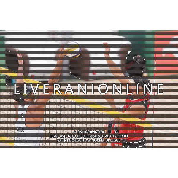 21.08.2014 - Stare Jablonki , siatkowka plazowa , beach volleyball , World Tour , FIVB Stare Jablonki Grand Slam 2014 , Polska (czerwone) - Brazylia (biale) , Poland - Brazil N/Z Ricardo Alex Costa Santos , Michal Kadziola Fot. Mariusz Palczynski / MPAimages.com/NEWSPIX.PL --- Newspix.pl /Agenzia Aldo Liverani sas - ITALY ONLY - Polonia - Brasile beach volley, World Tour, FIVB Stare Jablonki Grande Slam 2014 *** Local Caption *** www.newspix.pl mail us: info@newspix.pl call us: 0048 022 23 22 222 --- Polish Picture Agency by Ringier Axel Springer Poland