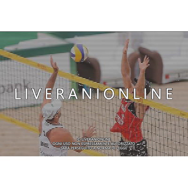 21.08.2014 - Stare Jablonki , siatkowka plazowa , beach volleyball , World Tour , FIVB Stare Jablonki Grand Slam 2014 , Polska (czerwone) - Brazylia (biale) , Poland - Brazil N/Z Marcio Henrique Barroso Araujo , Michal Kadziola Fot. Mariusz Palczynski / MPAimages.com/NEWSPIX.PL --- Newspix.pl /Agenzia Aldo Liverani sas - ITALY ONLY - Polonia - Brasile beach volley, World Tour, FIVB Stare Jablonki Grande Slam 2014 *** Local Caption *** www.newspix.pl mail us: info@newspix.pl call us: 0048 022 23 22 222 --- Polish Picture Agency by Ringier Axel Springer Poland
