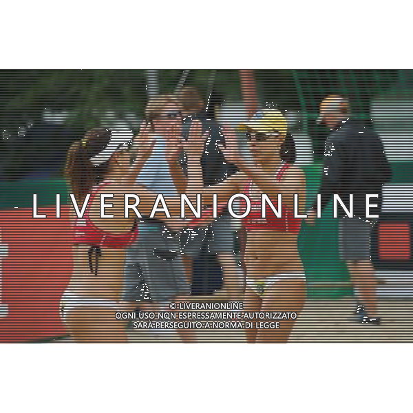 21.08.2014 - Stare Jablonki , siatkowka plazowa , beach volleyball , World Tour , FIVB Stare Jablonki Grand Slam 2014 , Brazylia (czerwone) - Wlochy (zielone) , Brazil (red) - Italy (green) N/Z Juliana Felisberta Da Silva Fot. Karol Bartnik / MPAimages.com/NEWSPIX.PL --- Newspix.pl /Agenzia Aldo Liverani sas - ITALY ONLY - Brasile - Italia beach volley femminile, World Tour, FIVB Stare Jablonki Grande Slam 2014 *** Local Caption *** www.newspix.pl mail us: info@newspix.pl call us: 0048 022 23 22 222 --- Polish Picture Agency by Ringier Axel Springer Poland