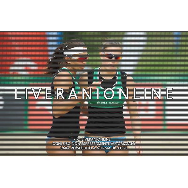 21.08.2014 - Stare Jablonki , siatkowka plazowa , beach volleyball , World Tour , FIVB Stare Jablonki Grand Slam 2014 , Brazylia (czerwone) - Wlochy (zielone) , Brazil (red) - Italy (green) N/Z Marta Menegatti , Viktoria Orsi Toth Fot. Karol Bartnik / MPAimages.com/NEWSPIX.PL --- Newspix.pl /Agenzia Aldo Liverani sas - ITALY ONLY - Brasile - Italia beach volley femminile, World Tour, FIVB Stare Jablonki Grande Slam 2014 *** Local Caption *** www.newspix.pl mail us: info@newspix.pl call us: 0048 022 23 22 222 --- Polish Picture Agency by Ringier Axel Springer Poland