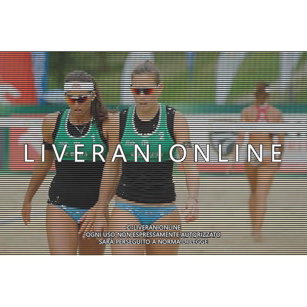 21.08.2014 - Stare Jablonki , siatkowka plazowa , beach volleyball , World Tour , FIVB Stare Jablonki Grand Slam 2014 , Brazylia (czerwone) - Wlochy (zielone) , Brazil (red) - Italy (green) N/Z Marta Menegatti , Viktoria Orsi Toth Fot. Karol Bartnik / MPAimages.com/NEWSPIX.PL --- Newspix.pl /Agenzia Aldo Liverani sas - ITALY ONLY - Brasile - Italia beach volley femminile, World Tour, FIVB Stare Jablonki Grande Slam 2014 *** Local Caption *** www.newspix.pl mail us: info@newspix.pl call us: 0048 022 23 22 222 --- Polish Picture Agency by Ringier Axel Springer Poland