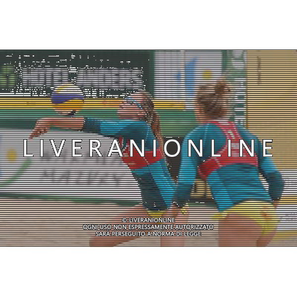 21.08.2014 - Stare Jablonki , siatkowka plazowa , beach volleyball , World Tour , FIVB Stare Jablonki Grand Slam 2014 , Niemcy (zielone) - Polska (czerwone) , Germany - Poland N/Z Karolina Baran , Jagoda Gruszczynska Fot. Mariusz Palczynski / MPAimages.com/NEWSPIX.PL --- Newspix.pl /Agenzia Aldo Liverani sas - ITALY ONLY - Germania - Polonia beach volle femminile, World Tour, FIVB Stare Jablonki Grande Slam 2014 *** Local Caption *** www.newspix.pl mail us: info@newspix.pl call us: 0048 022 23 22 222 --- Polish Picture Agency by Ringier Axel Springer Poland