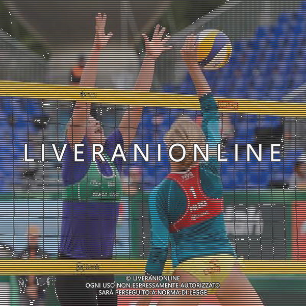 21.08.2014 - Stare Jablonki , siatkowka plazowa , beach volleyball , World Tour , FIVB Stare Jablonki Grand Slam 2014 , Niemcy (zielone) - Polska (czerwone) , Germany - Poland N/Z Britta Buthe , Jagoda Gruszczynska Fot. Mariusz Palczynski / MPAimages.com/NEWSPIX.PL --- Newspix.pl /Agenzia Aldo Liverani sas - ITALY ONLY - Germania - Polonia beach volle femminile, World Tour, FIVB Stare Jablonki Grande Slam 2014 *** Local Caption *** www.newspix.pl mail us: info@newspix.pl call us: 0048 022 23 22 222 --- Polish Picture Agency by Ringier Axel Springer Poland