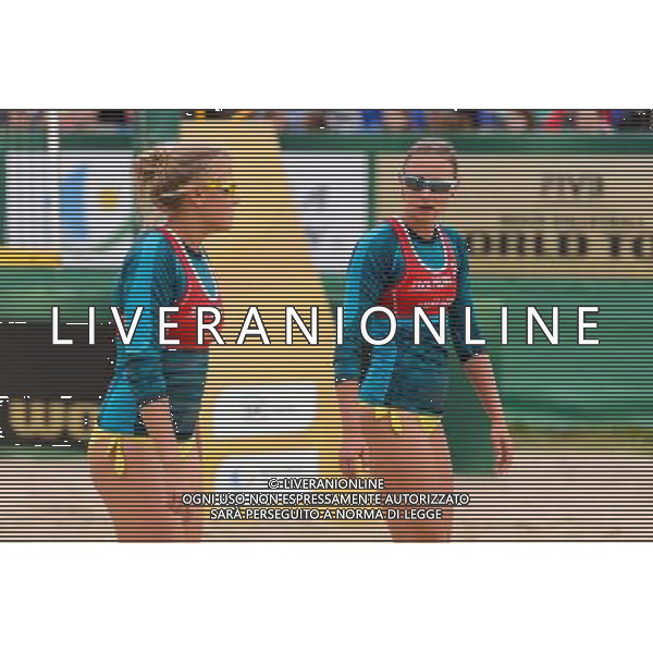 21.08.2014 - Stare Jablonki , siatkowka plazowa , beach volleyball , World Tour , FIVB Stare Jablonki Grand Slam 2014 , Niemcy (zielone) - Polska (czerwone) , Germany - Poland N/Z Jagoda Gruszczynska , Karolina Baran Fot. Mariusz Palczynski / MPAimages.com/NEWSPIX.PL --- Newspix.pl /Agenzia Aldo Liverani sas - ITALY ONLY - Germania - Polonia beach volle femminile, World Tour, FIVB Stare Jablonki Grande Slam 2014 *** Local Caption *** www.newspix.pl mail us: info@newspix.pl call us: 0048 022 23 22 222 --- Polish Picture Agency by Ringier Axel Springer Poland