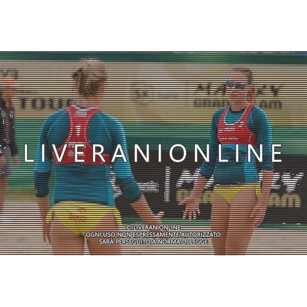 21.08.2014 - Stare Jablonki , siatkowka plazowa , beach volleyball , World Tour , FIVB Stare Jablonki Grand Slam 2014 , Niemcy (zielone) - Polska (czerwone) , Germany - Poland N/Z Jagoda Gruszczynska , Karolina Baran Fot. Mariusz Palczynski / MPAimages.com/NEWSPIX.PL --- Newspix.pl /Agenzia Aldo Liverani sas - ITALY ONLY - Germania - Polonia beach volle femminile, World Tour, FIVB Stare Jablonki Grande Slam 2014 *** Local Caption *** www.newspix.pl mail us: info@newspix.pl call us: 0048 022 23 22 222 --- Polish Picture Agency by Ringier Axel Springer Poland