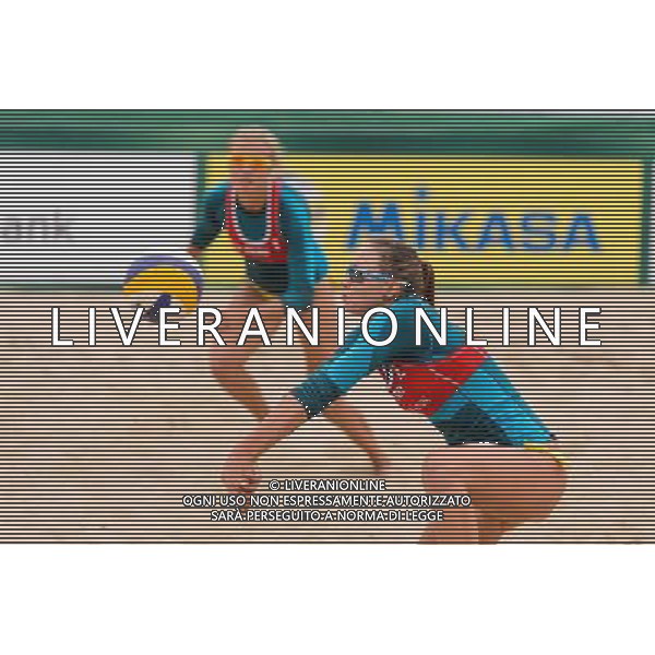 21.08.2014 - Stare Jablonki , siatkowka plazowa , beach volleyball , World Tour , FIVB Stare Jablonki Grand Slam 2014 , Niemcy (zielone) - Polska (czerwone) , Germany - Poland N/Z Karolina Baran Fot. Mariusz Palczynski / MPAimages.com/NEWSPIX.PL --- Newspix.pl /Agenzia Aldo Liverani sas - ITALY ONLY - Germania - Polonia beach volle femminile, World Tour, FIVB Stare Jablonki Grande Slam 2014 *** Local Caption *** www.newspix.pl mail us: info@newspix.pl call us: 0048 022 23 22 222 --- Polish Picture Agency by Ringier Axel Springer Poland