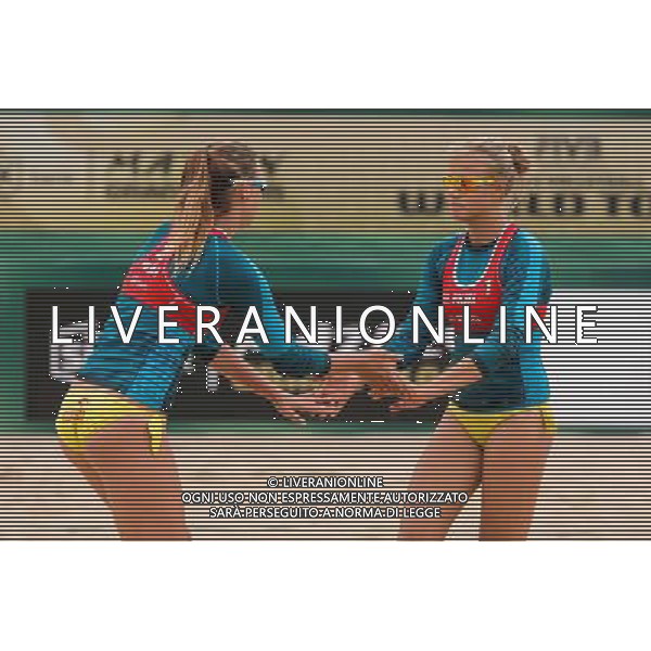 21.08.2014 - Stare Jablonki , siatkowka plazowa , beach volleyball , World Tour , FIVB Stare Jablonki Grand Slam 2014 , Niemcy (zielone) - Polska (czerwone) , Germany - Poland N/Z Karolina Baran , Jagoda Gruszczynska Fot. Mariusz Palczynski / MPAimages.com/NEWSPIX.PL --- Newspix.pl /Agenzia Aldo Liverani sas - ITALY ONLY - Germania - Polonia beach volle femminile, World Tour, FIVB Stare Jablonki Grande Slam 2014 *** Local Caption *** www.newspix.pl mail us: info@newspix.pl call us: 0048 022 23 22 222 --- Polish Picture Agency by Ringier Axel Springer Poland