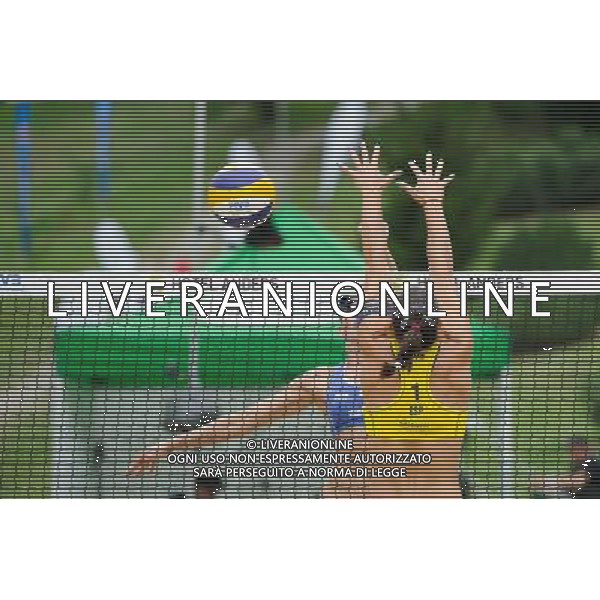 21.08.2014 - Stare Jablonki , siatkowka plazowa , beach volleyball , World Tour , FIVB Stare Jablonki Grand Slam 2014 , Hiszpania (zolte) - Australia (niebieskie) , Spain (yellow) - Australia (blue) N/Z Taliqua Clancy , Liliana Fernandez Steiner Fot. Karol Bartnik / MPAimages.com/NEWSPIX.PL --- Newspix.pl /Agenzia Aldo Liverani sas - ITALY ONLY - Australia - Spagna beach volley femminile, World Tour, FIVB Stare Jablonki Grande Slam 2014 *** Local Caption *** www.newspix.pl mail us: info@newspix.pl call us: 0048 022 23 22 222 --- Polish Picture Agency by Ringier Axel Springer Poland