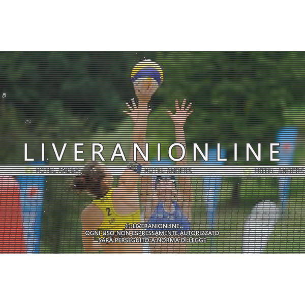 21.08.2014 - Stare Jablonki , siatkowka plazowa , beach volleyball , World Tour , FIVB Stare Jablonki Grand Slam 2014 , Hiszpania (zolte) - Australia (niebieskie) , Spain (yellow) - Australia (blue) N/Z Elsa Baquerizo McMillan , Louise Bawden Fot. Karol Bartnik / MPAimages.com/NEWSPIX.PL --- Newspix.pl /Agenzia Aldo Liverani sas - ITALY ONLY - Australia - Spagna beach volley femminile, World Tour, FIVB Stare Jablonki Grande Slam 2014 *** Local Caption *** www.newspix.pl mail us: info@newspix.pl call us: 0048 022 23 22 222 --- Polish Picture Agency by Ringier Axel Springer Poland