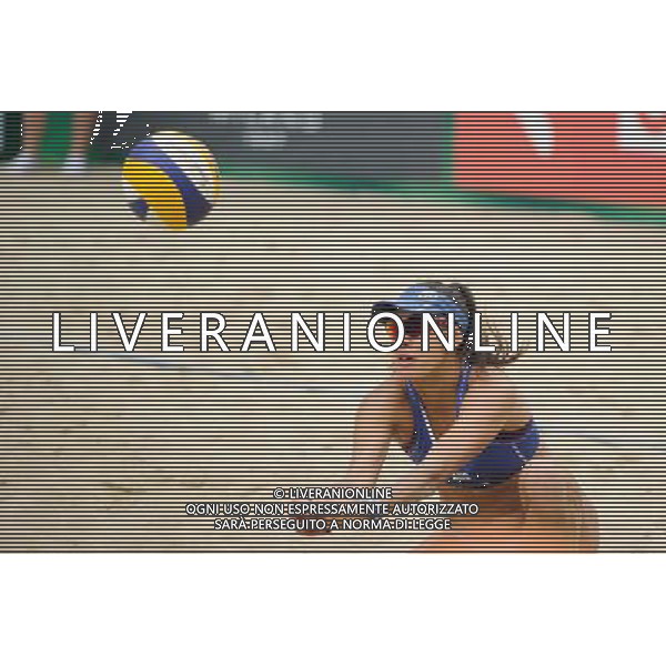 21.08.2014 - Stare Jablonki , siatkowka plazowa , beach volleyball , World Tour , FIVB Stare Jablonki Grand Slam 2014 , Hiszpania (zolte) - Australia (niebieskie) , Spain (yellow) - Australia (blue) N/Z Taliqua Clancy Fot. Karol Bartnik / MPAimages.com/NEWSPIX.PL --- Newspix.pl /Agenzia Aldo Liverani sas - ITALY ONLY - Australia - Spagna beach volley femminile, World Tour, FIVB Stare Jablonki Grande Slam 2014 *** Local Caption *** www.newspix.pl mail us: info@newspix.pl call us: 0048 022 23 22 222 --- Polish Picture Agency by Ringier Axel Springer Poland