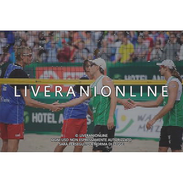 21.08.2014 - Stare Jablonki , siatkowka plazowa , beach volleyball , World Tour , FIVB Stare Jablonki Grand Slam 2014 , Polska (zielone) - Rosja (niebieskie) , Poland (green) - Russia (blue) N/Z Dmitri Barsouk , Grzegorz Fijalek , Mariusz Prudel Fot. Karol Bartnik / MPAimages.com/NEWSPIX.PL --- Newspix.pl /Agenzia Aldo Liverani sas - ITALY ONLY - Polonia - Russia beach volley maschile, World Tour, FIVB Stare Jablonki Grande Slam 2014 *** Local Caption *** www.newspix.pl mail us: info@newspix.pl call us: 0048 022 23 22 222 --- Polish Picture Agency by Ringier Axel Springer Poland