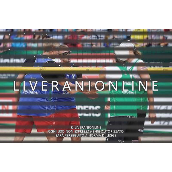 21.08.2014 - Stare Jablonki , siatkowka plazowa , beach volleyball , World Tour , FIVB Stare Jablonki Grand Slam 2014 , Polska (zielone) - Rosja (niebieskie) , Poland (green) - Russia (blue) N/Z Dmitri Barsouk , Nikita Liamin , Grzegorz Fijalek Fot. Karol Bartnik / MPAimages.com/NEWSPIX.PL --- Newspix.pl /Agenzia Aldo Liverani sas - ITALY ONLY - Polonia - Russia beach volley maschile, World Tour, FIVB Stare Jablonki Grande Slam 2014 *** Local Caption *** www.newspix.pl mail us: info@newspix.pl call us: 0048 022 23 22 222 --- Polish Picture Agency by Ringier Axel Springer Poland