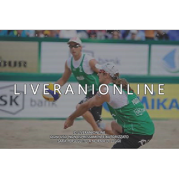 21.08.2014 - Stare Jablonki , siatkowka plazowa , beach volleyball , World Tour , FIVB Stare Jablonki Grand Slam 2014 , Polska (zielone) - Rosja (niebieskie) , Poland (green) - Russia (blue) N/Z Mariusz Prudel Fot. Karol Bartnik / MPAimages.com/NEWSPIX.PL --- Newspix.pl /Agenzia Aldo Liverani sas - ITALY ONLY - Polonia - Russia beach volley maschile, World Tour, FIVB Stare Jablonki Grande Slam 2014 *** Local Caption *** www.newspix.pl mail us: info@newspix.pl call us: 0048 022 23 22 222 --- Polish Picture Agency by Ringier Axel Springer Poland
