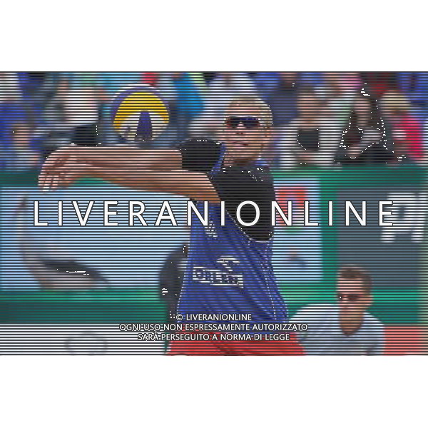 21.08.2014 - Stare Jablonki , siatkowka plazowa , beach volleyball , World Tour , FIVB Stare Jablonki Grand Slam 2014 , Polska (zielone) - Rosja (niebieskie) , Poland (green) - Russia (blue) N/Z Dmitri Barsouk Fot. Karol Bartnik / MPAimages.com/NEWSPIX.PL --- Newspix.pl /Agenzia Aldo Liverani sas - ITALY ONLY - Polonia - Russia beach volley maschile, World Tour, FIVB Stare Jablonki Grande Slam 2014 *** Local Caption *** www.newspix.pl mail us: info@newspix.pl call us: 0048 022 23 22 222 --- Polish Picture Agency by Ringier Axel Springer Poland