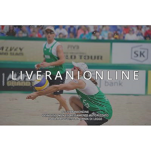 21.08.2014 - Stare Jablonki , siatkowka plazowa , beach volleyball , World Tour , FIVB Stare Jablonki Grand Slam 2014 , Polska (zielone) - Rosja (niebieskie) , Poland (green) - Russia (blue) N/Z Mariusz Prudel Fot. Karol Bartnik / MPAimages.com/NEWSPIX.PL --- Newspix.pl /Agenzia Aldo Liverani sas - ITALY ONLY - Polonia - Russia beach volley maschile, World Tour, FIVB Stare Jablonki Grande Slam 2014 *** Local Caption *** www.newspix.pl mail us: info@newspix.pl call us: 0048 022 23 22 222 --- Polish Picture Agency by Ringier Axel Springer Poland