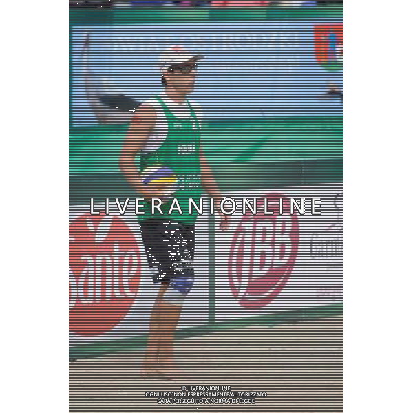 21.08.2014 - Stare Jablonki , siatkowka plazowa , beach volleyball , World Tour , FIVB Stare Jablonki Grand Slam 2014 , Polska (zielone) - Rosja (niebieskie) , Poland (green) - Russia (blue) N/Z Grzegorz Fijalek Fot. Karol Bartnik / MPAimages.com/NEWSPIX.PL --- Newspix.pl /Agenzia Aldo Liverani sas - ITALY ONLY - Polonia - Russia beach volley maschile, World Tour, FIVB Stare Jablonki Grande Slam 2014 *** Local Caption *** www.newspix.pl mail us: info@newspix.pl call us: 0048 022 23 22 222 --- Polish Picture Agency by Ringier Axel Springer Poland