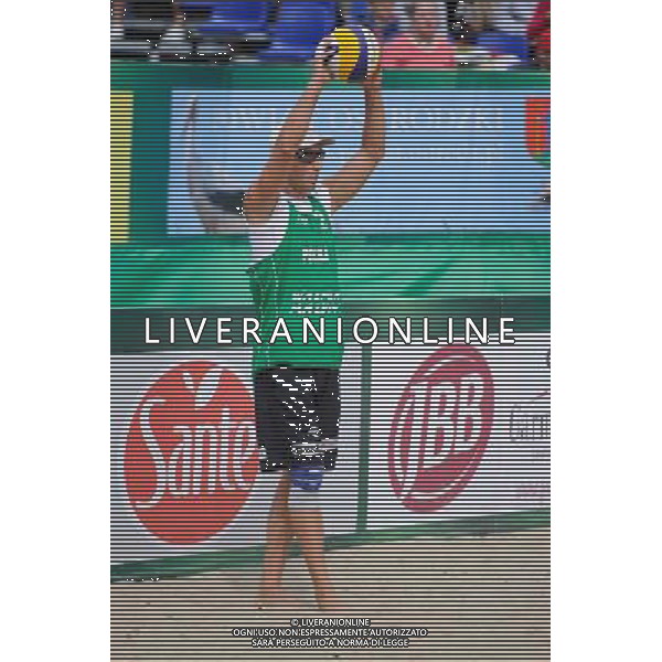 21.08.2014 - Stare Jablonki , siatkowka plazowa , beach volleyball , World Tour , FIVB Stare Jablonki Grand Slam 2014 , Polska (zielone) - Rosja (niebieskie) , Poland (green) - Russia (blue) N/Z Grzegorz Fijalek Fot. Karol Bartnik / MPAimages.com/NEWSPIX.PL --- Newspix.pl /Agenzia Aldo Liverani sas - ITALY ONLY - Polonia - Russia beach volley maschile, World Tour, FIVB Stare Jablonki Grande Slam 2014 *** Local Caption *** www.newspix.pl mail us: info@newspix.pl call us: 0048 022 23 22 222 --- Polish Picture Agency by Ringier Axel Springer Poland