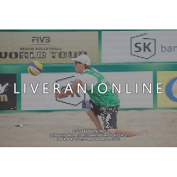 21.08.2014 - Stare Jablonki , siatkowka plazowa , beach volleyball , World Tour , FIVB Stare Jablonki Grand Slam 2014 , Polska (zielone) - Rosja (niebieskie) , Poland (green) - Russia (blue) N/Z Grzegorz Fijalek Fot. Karol Bartnik / MPAimages.com/NEWSPIX.PL --- Newspix.pl /Agenzia Aldo Liverani sas - ITALY ONLY - Polonia - Russia beach volley maschile, World Tour, FIVB Stare Jablonki Grande Slam 2014 *** Local Caption *** www.newspix.pl mail us: info@newspix.pl call us: 0048 022 23 22 222 --- Polish Picture Agency by Ringier Axel Springer Poland