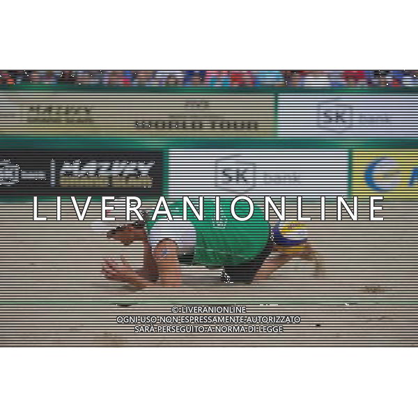 21.08.2014 - Stare Jablonki , siatkowka plazowa , beach volleyball , World Tour , FIVB Stare Jablonki Grand Slam 2014 , Polska (zielone) - Rosja (niebieskie) , Poland (green) - Russia (blue) N/Z Grzegorz Fijalek Fot. Karol Bartnik / MPAimages.com/NEWSPIX.PL --- Newspix.pl /Agenzia Aldo Liverani sas - ITALY ONLY - Polonia - Russia beach volley maschile, World Tour, FIVB Stare Jablonki Grande Slam 2014 *** Local Caption *** www.newspix.pl mail us: info@newspix.pl call us: 0048 022 23 22 222 --- Polish Picture Agency by Ringier Axel Springer Poland