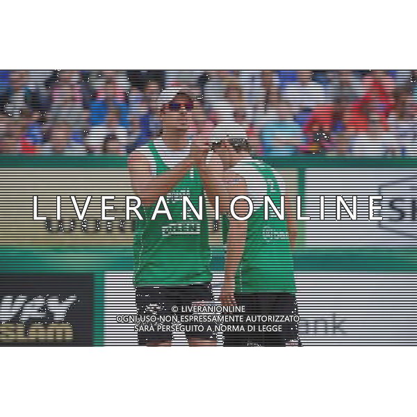 21.08.2014 - Stare Jablonki , siatkowka plazowa , beach volleyball , World Tour , FIVB Stare Jablonki Grand Slam 2014 , Polska (zielone) - Rosja (niebieskie) , Poland (green) - Russia (blue) N/Z Mariusz Prudek , Grzegorz Fijalek Fot. Karol Bartnik / MPAimages.com/NEWSPIX.PL --- Newspix.pl /Agenzia Aldo Liverani sas - ITALY ONLY - Polonia - Russia beach volley maschile, World Tour, FIVB Stare Jablonki Grande Slam 2014 *** Local Caption *** www.newspix.pl mail us: info@newspix.pl call us: 0048 022 23 22 222 --- Polish Picture Agency by Ringier Axel Springer Poland