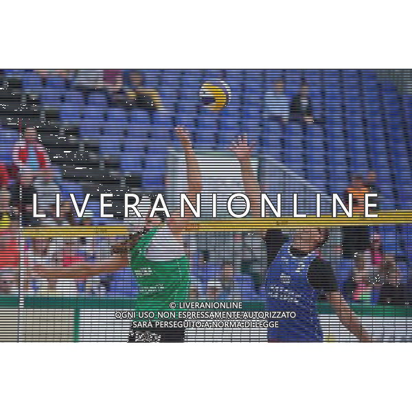 21.08.2014 - Stare Jablonki , siatkowka plazowa , beach volleyball , World Tour , FIVB Stare Jablonki Grand Slam 2014 , Polska (zielone) - Rosja (niebieskie) , Poland (green) - Russia (blue) N/Z Mariusz Prudel , Nikita Liamin Fot. Karol Bartnik / MPAimages.com/NEWSPIX.PL --- Newspix.pl /Agenzia Aldo Liverani sas - ITALY ONLY - Polonia - Russia beach volley maschile, World Tour, FIVB Stare Jablonki Grande Slam 2014 *** Local Caption *** www.newspix.pl mail us: info@newspix.pl call us: 0048 022 23 22 222 --- Polish Picture Agency by Ringier Axel Springer Poland