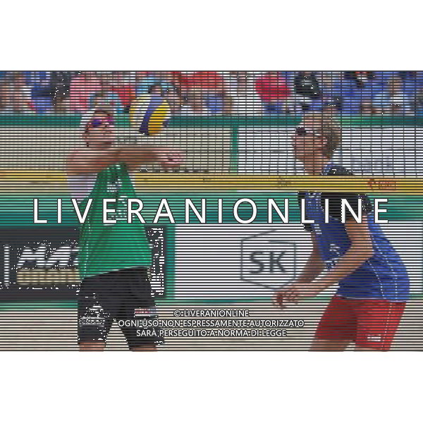 21.08.2014 - Stare Jablonki , siatkowka plazowa , beach volleyball , World Tour , FIVB Stare Jablonki Grand Slam 2014 , Polska (zielone) - Rosja (niebieskie) , Poland (green) - Russia (blue) N/Z Mariusz Prudel , Dmitri Barsouk Fot. Karol Bartnik / MPAimages.com/NEWSPIX.PL --- Newspix.pl /Agenzia Aldo Liverani sas - ITALY ONLY - Polonia - Russia beach volley maschile, World Tour, FIVB Stare Jablonki Grande Slam 2014 *** Local Caption *** www.newspix.pl mail us: info@newspix.pl call us: 0048 022 23 22 222 --- Polish Picture Agency by Ringier Axel Springer Poland