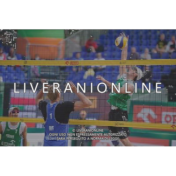 21.08.2014 - Stare Jablonki , siatkowka plazowa , beach volleyball , World Tour , FIVB Stare Jablonki Grand Slam 2014 , Polska (zielone) - Rosja (niebieskie) , Poland (green) - Russia (blue) N/Z Dmitri Barsouk , Grzegrz Fijalek Fot. Karol Bartnik / MPAimages.com/NEWSPIX.PL --- Newspix.pl /Agenzia Aldo Liverani sas - ITALY ONLY - Polonia - Russia beach volley maschile, World Tour, FIVB Stare Jablonki Grande Slam 2014 *** Local Caption *** www.newspix.pl mail us: info@newspix.pl call us: 0048 022 23 22 222 --- Polish Picture Agency by Ringier Axel Springer Poland