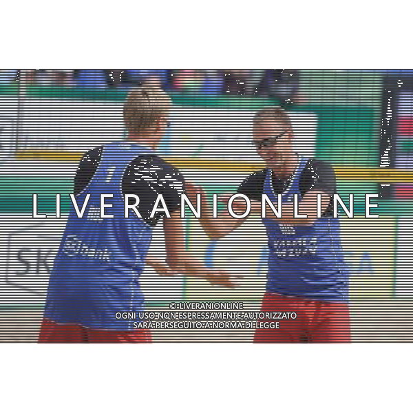 21.08.2014 - Stare Jablonki , siatkowka plazowa , beach volleyball , World Tour , FIVB Stare Jablonki Grand Slam 2014 , Polska (zielone) - Rosja (niebieskie) , Poland (green) - Russia (blue) N/Z Nikita Liamin Fot. Karol Bartnik / MPAimages.com/NEWSPIX.PL --- Newspix.pl /Agenzia Aldo Liverani sas - ITALY ONLY - Polonia - Russia beach volley maschile, World Tour, FIVB Stare Jablonki Grande Slam 2014 *** Local Caption *** www.newspix.pl mail us: info@newspix.pl call us: 0048 022 23 22 222 --- Polish Picture Agency by Ringier Axel Springer Poland