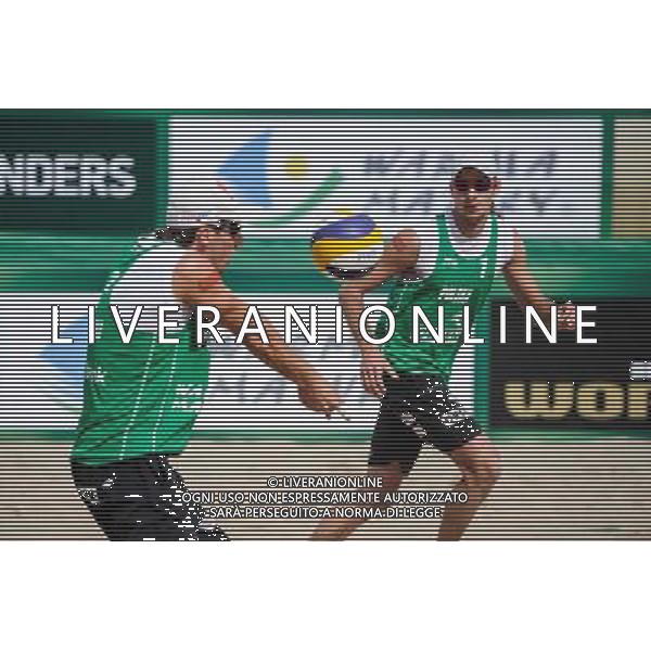21.08.2014 - Stare Jablonki , siatkowka plazowa , beach volleyball , World Tour , FIVB Stare Jablonki Grand Slam 2014 , Polska (zielone) - Rosja (niebieskie) , Poland (green) - Russia (blue) N/Z Grzegorz Fijalek , Mariusz Prudel Fot. Karol Bartnik / MPAimages.com/NEWSPIX.PL --- Newspix.pl /Agenzia Aldo Liverani sas - ITALY ONLY - Polonia - Russia beach volley maschile, World Tour, FIVB Stare Jablonki Grande Slam 2014 *** Local Caption *** www.newspix.pl mail us: info@newspix.pl call us: 0048 022 23 22 222 --- Polish Picture Agency by Ringier Axel Springer Poland