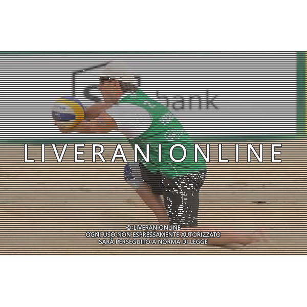 21.08.2014 - Stare Jablonki , siatkowka plazowa , beach volleyball , World Tour , FIVB Stare Jablonki Grand Slam 2014 , Polska (zielone) - Rosja (niebieskie) , Poland - Russia N/Z Grzegorz Fijalek Fot. Mariusz Palczynski / MPAimages.com/NEWSPIX.PL --- Newspix.pl /Agenzia Aldo Liverani sas - ITALY ONLY - Polonia - Russia beach volley maschile, World Tour, FIVB Stare Jablonki Grande Slam 2014 *** Local Caption *** www.newspix.pl mail us: info@newspix.pl call us: 0048 022 23 22 222 --- Polish Picture Agency by Ringier Axel Springer Poland