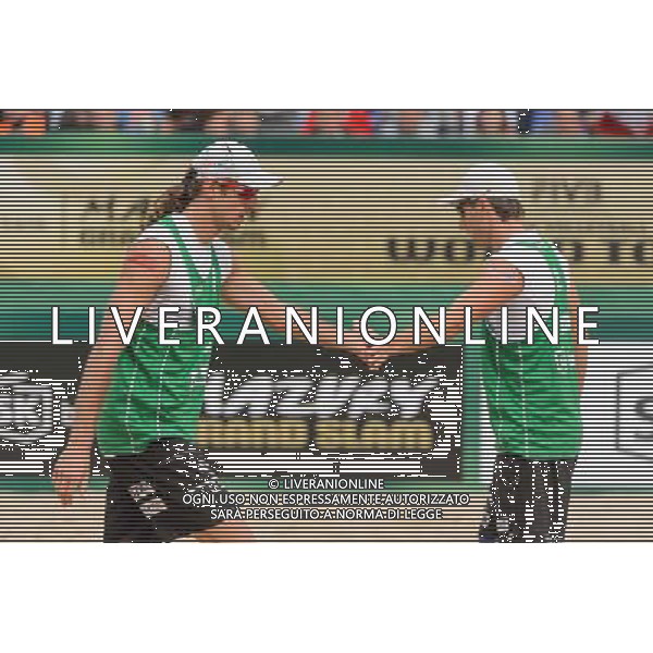 21.08.2014 - Stare Jablonki , siatkowka plazowa , beach volleyball , World Tour , FIVB Stare Jablonki Grand Slam 2014 , Polska (zielone) - Rosja (niebieskie) , Poland - Russia N/Z Mariusz Prudel , Grzegorz Fijalek Fot. Mariusz Palczynski / MPAimages.com/NEWSPIX.PL --- Newspix.pl /Agenzia Aldo Liverani sas - ITALY ONLY - Polonia - Russia beach volley maschile, World Tour, FIVB Stare Jablonki Grande Slam 2014 *** Local Caption *** www.newspix.pl mail us: info@newspix.pl call us: 0048 022 23 22 222 --- Polish Picture Agency by Ringier Axel Springer Poland
